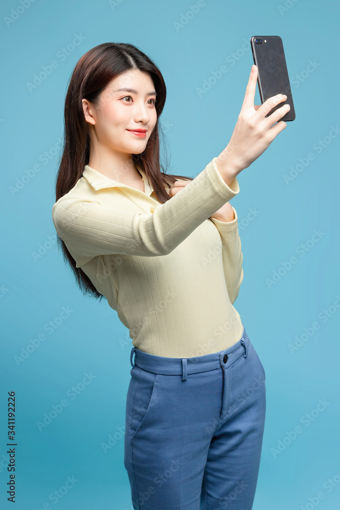 Asian girl on blue background

