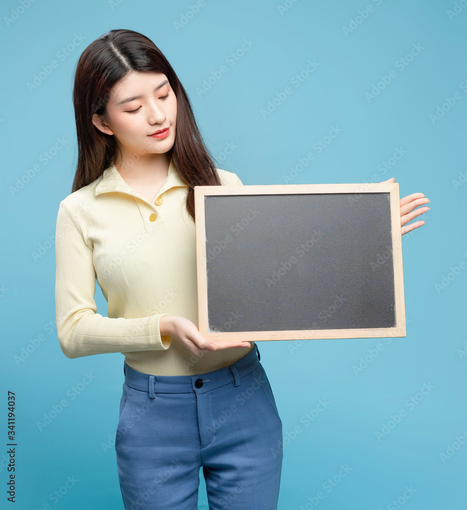 Asian girl on blue background

