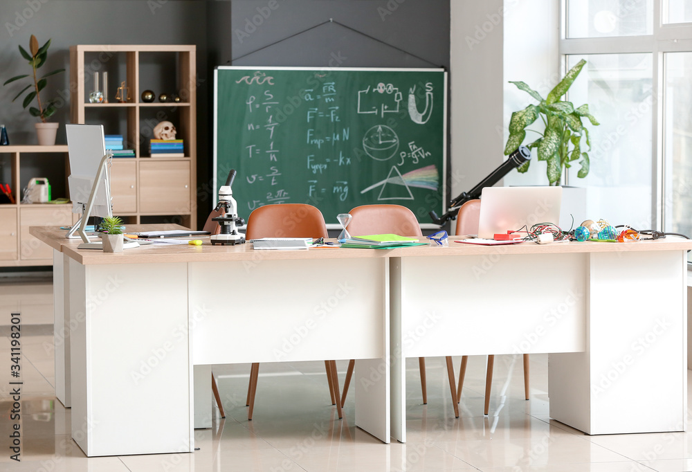 Interior of classroom prepared for physics lesson in modern school