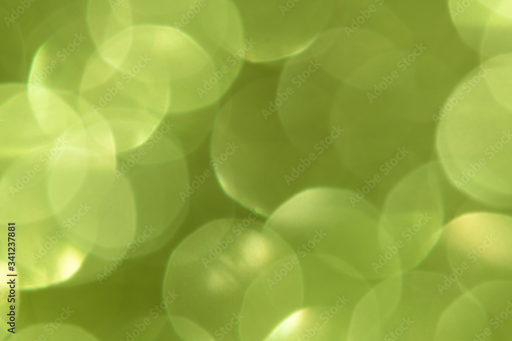 Shiny blurry green glitter textured background