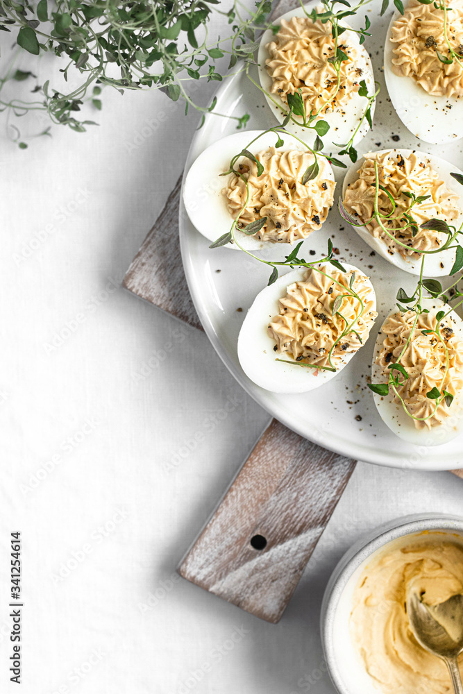 Deviled eggs on a white plate