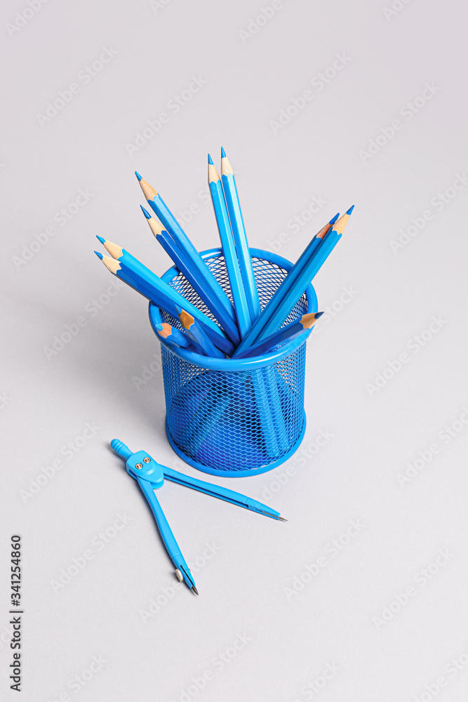 Holder with stationery on light background