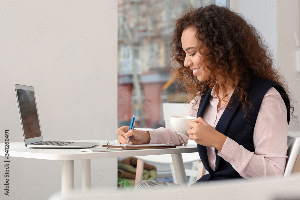 Business owner working in her cafe