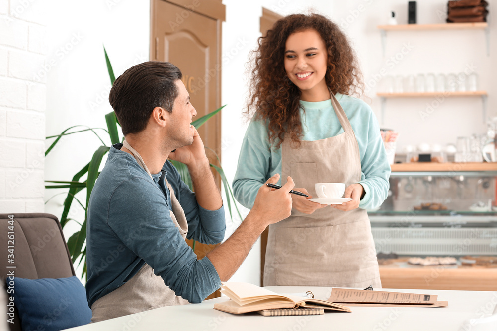 Business owners working in their cafe