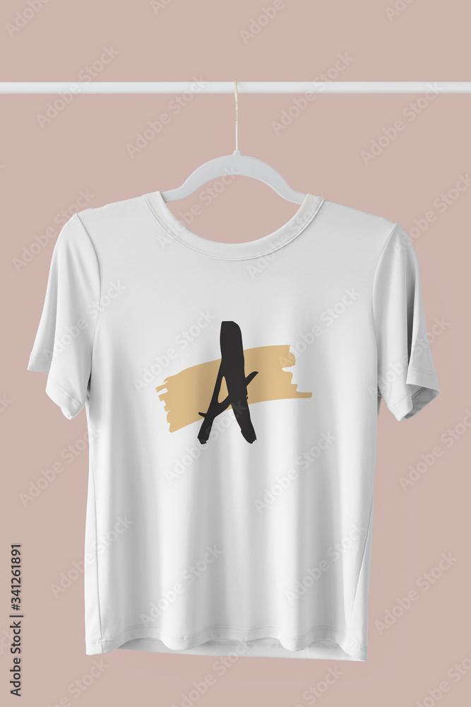 White t-shirt mockup hanging on a clothing rack