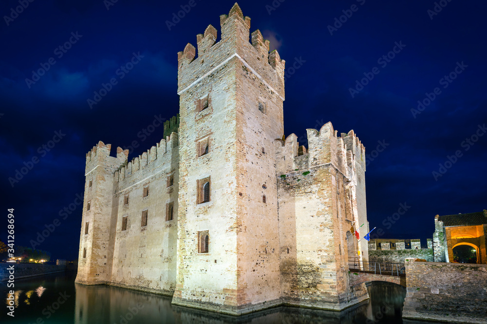 Scaligero Castle over the Garda lake in Sirmione at night, Italy