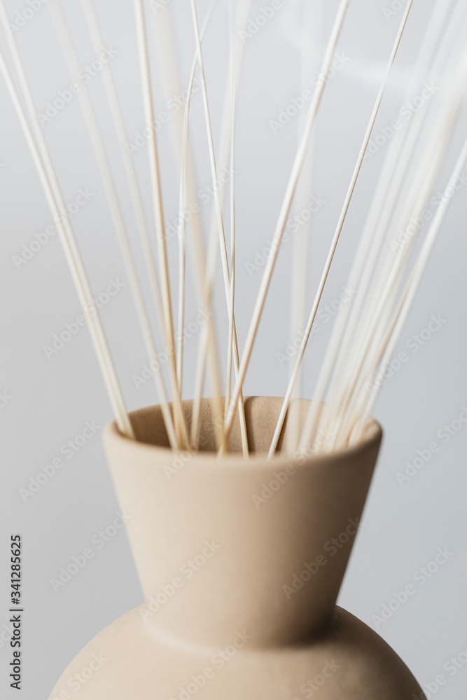 Ornamental grass in a brown vase