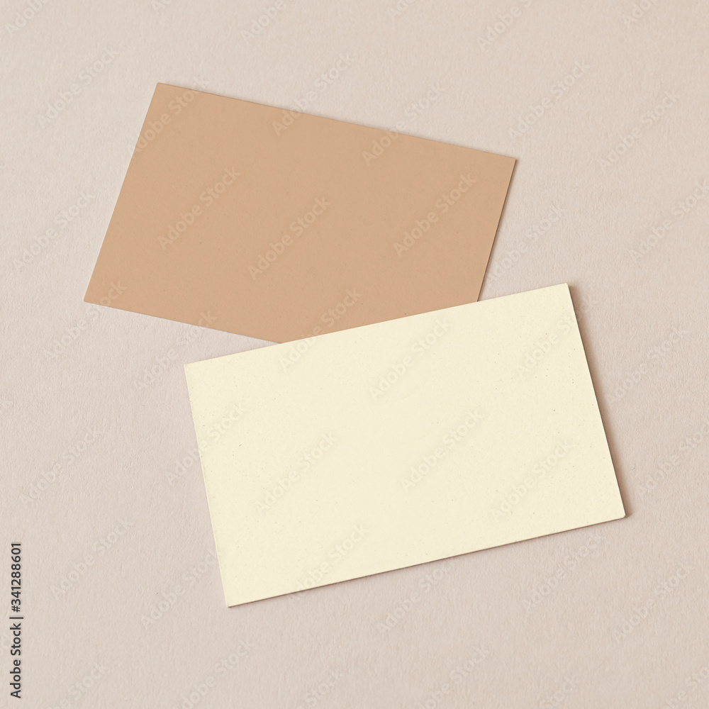 Business cards on beige background mockup