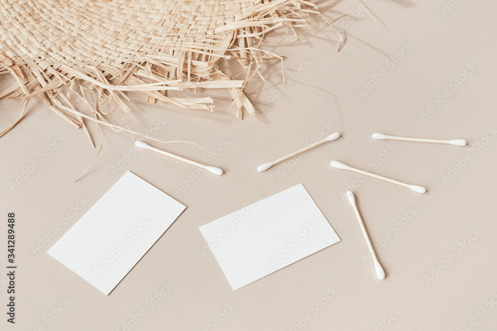 Blank business cards with cotton buds and woven mat