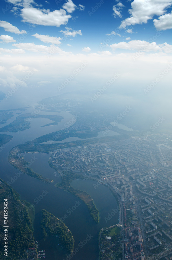 Aerial view of a green landscape with a river