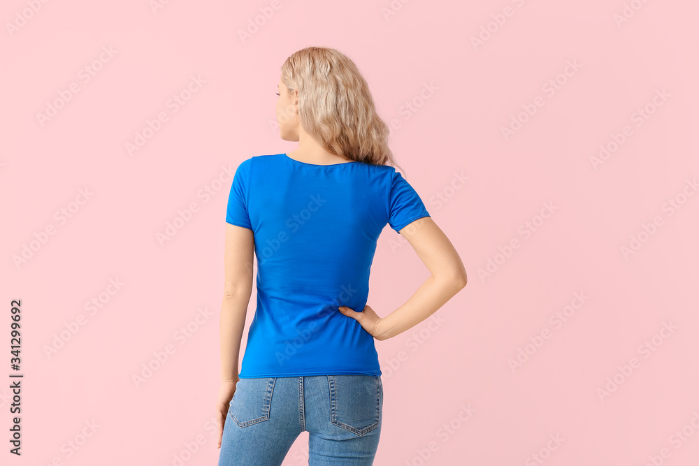 Woman in stylish t-shirt on color background