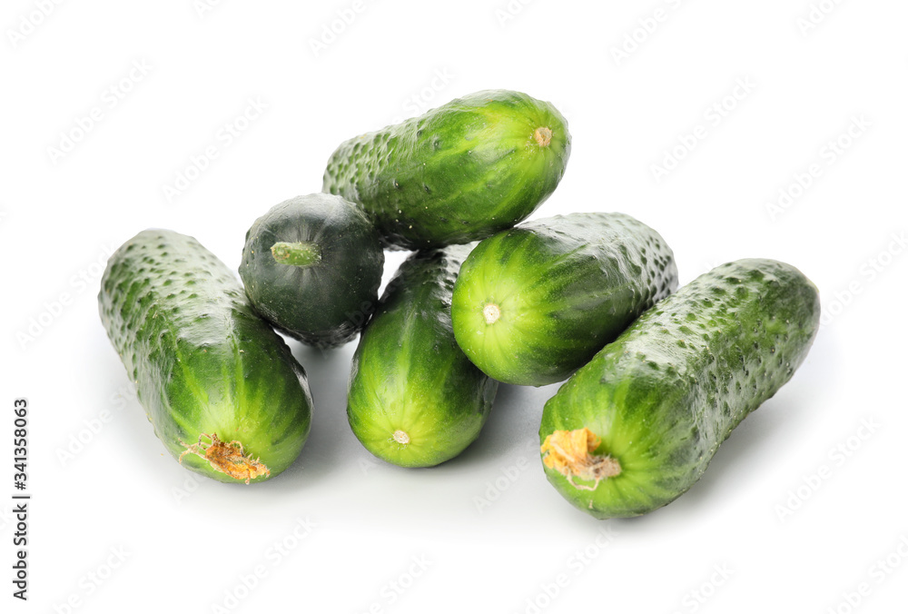 Green cucumbers on white background