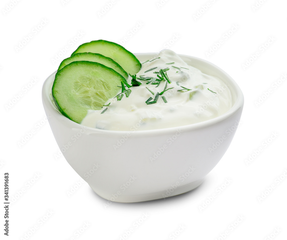 Delicious yogurt sauce with cucumber in bowl on white background