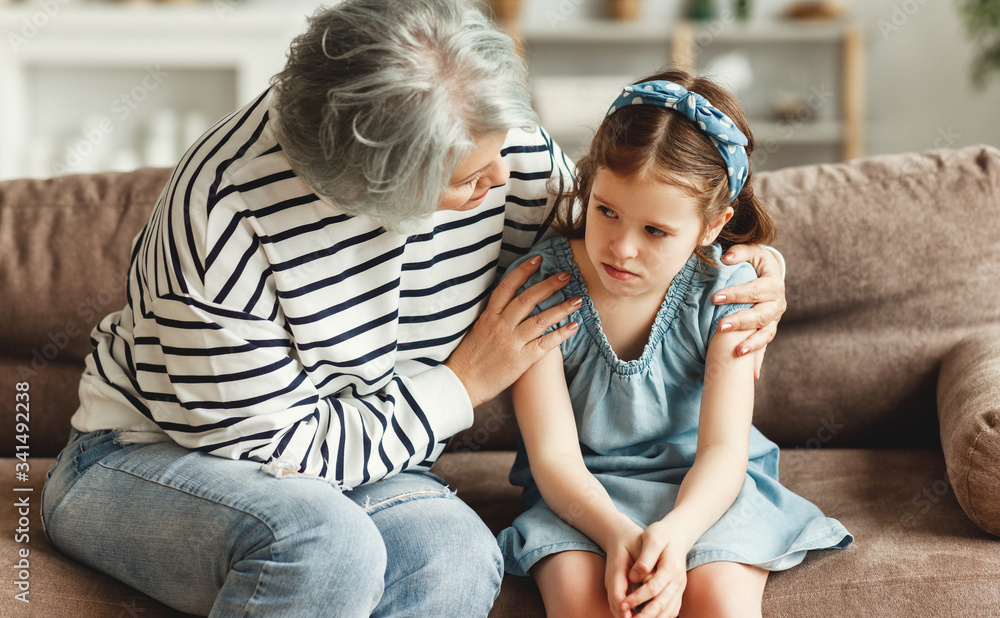 Grandmother supporting resentful granddaughter at home.