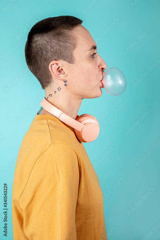 Skinhead woman listening to music