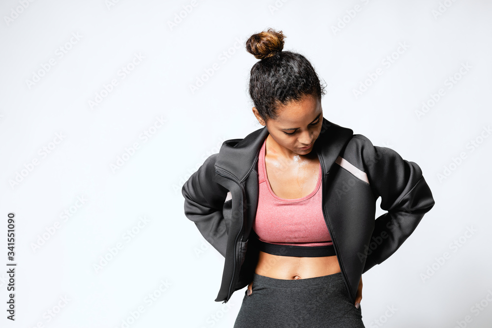 Sweaty woman in a sports bra