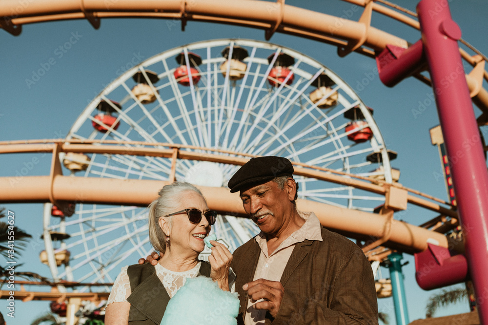 Senior couple enjoying candy floss