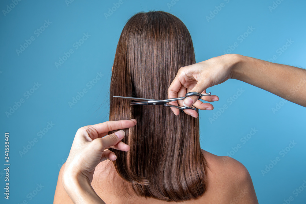 Young woman getting a haircut