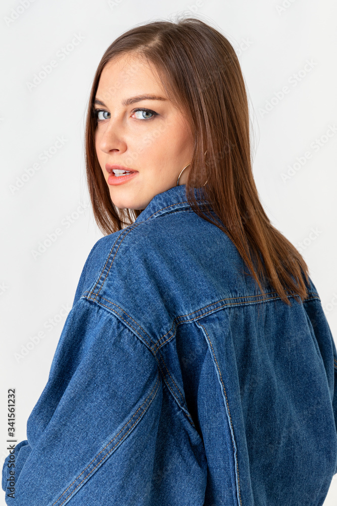 Beautiful young woman wearing denim jacket