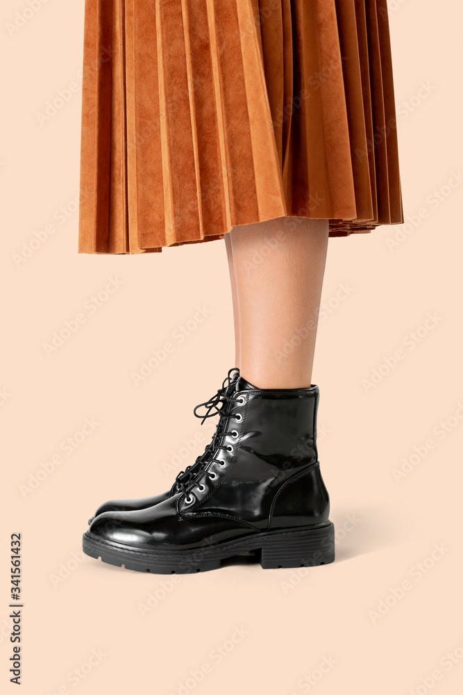 Woman in a skirt wearing combat boots