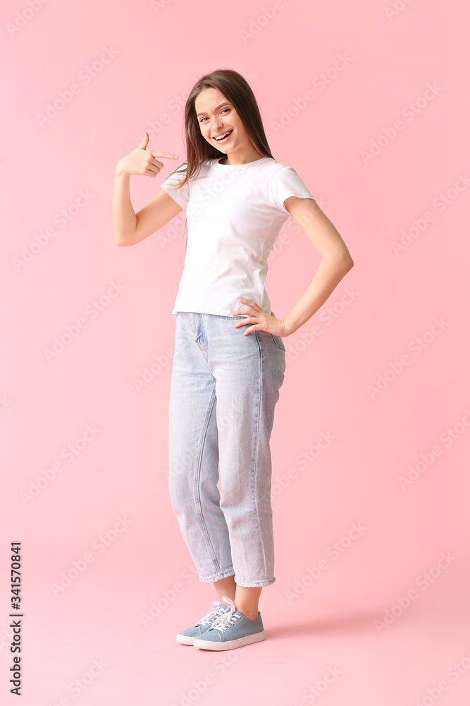 Young woman in stylish t-shirt on color background