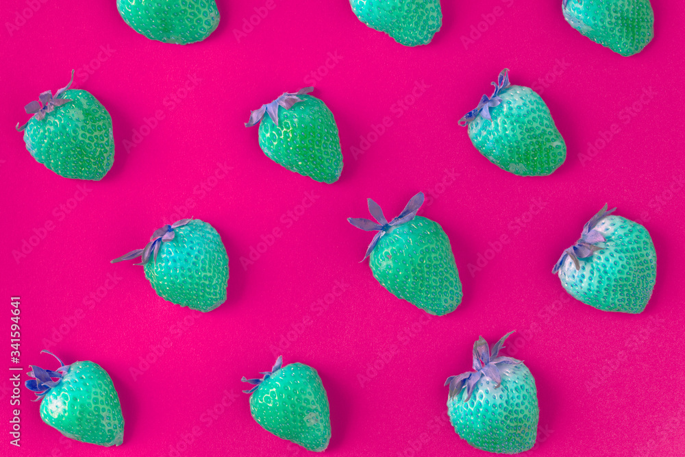 Neon green strawberries on pink patterned background