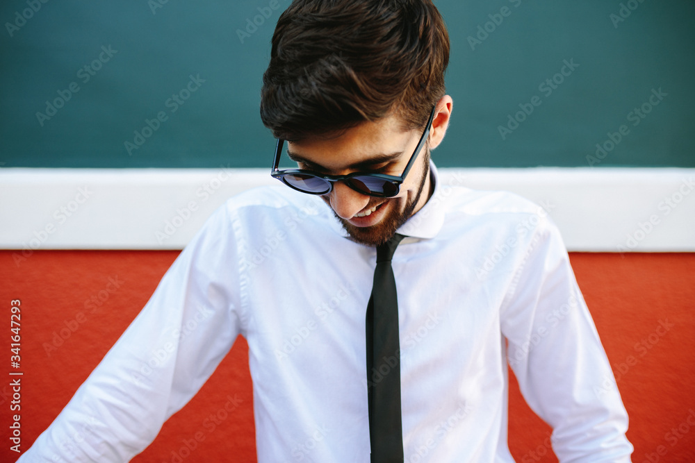 Businessman standing outdoors and smiling