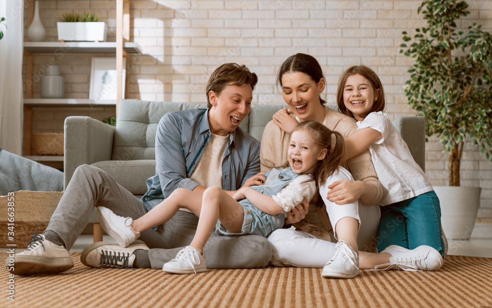 Two children with mother and father.