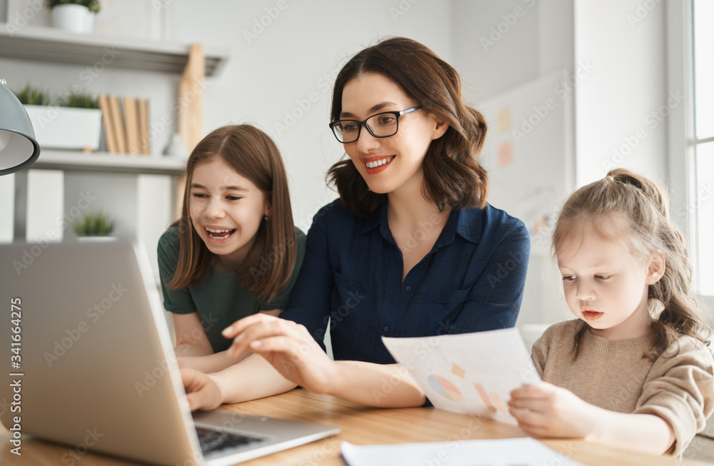 Woman working on a laptop.