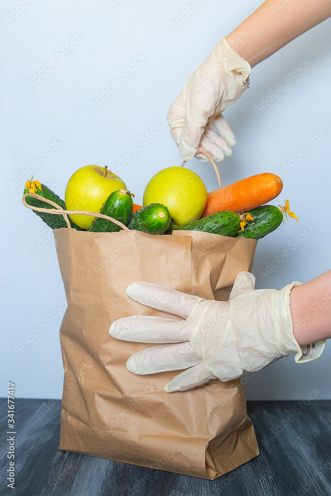 volunteer donation food box vegetables fruits on a blue and black background