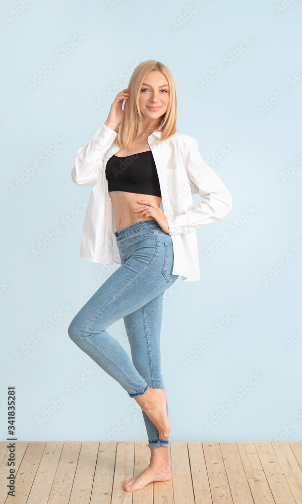 Slim woman on color background