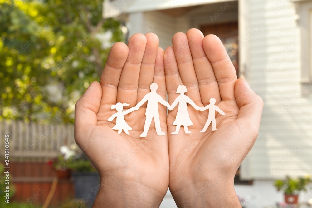 Paper chain family protected in cupped hands