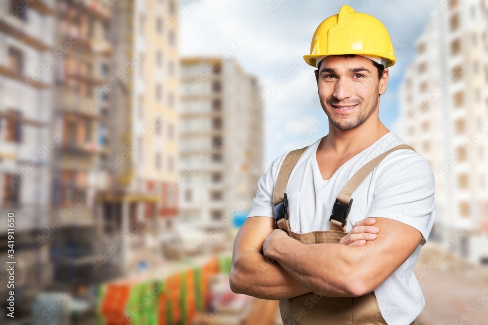 Portrait of happy young foreman with hard hat