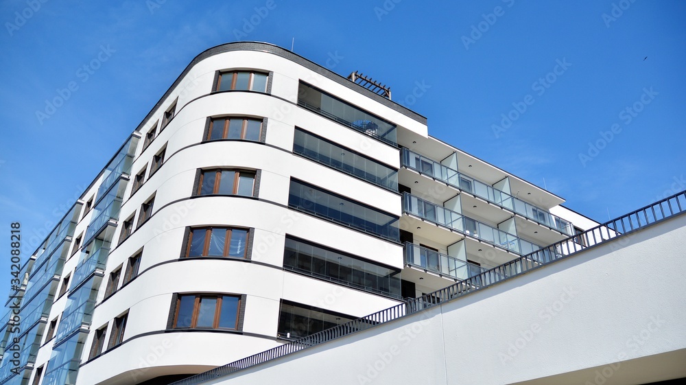 Modern condo building with big windows and modern facade.