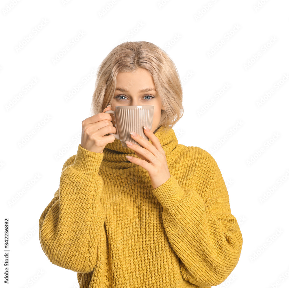 Beautiful young woman with tea on white background