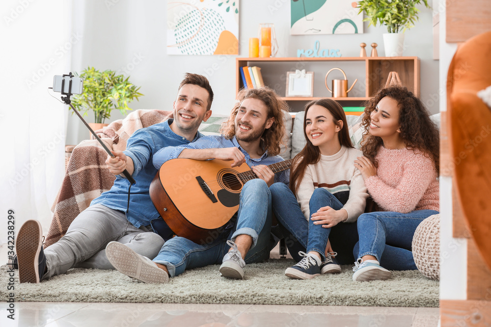 Friends taking selfie at home