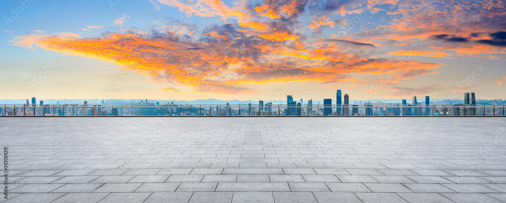 Empty square floor and chongqing city skyline at sunset,China.