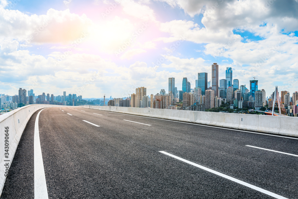 Empty asphalt road and Chongqing city skyline and buildings scenery,China.