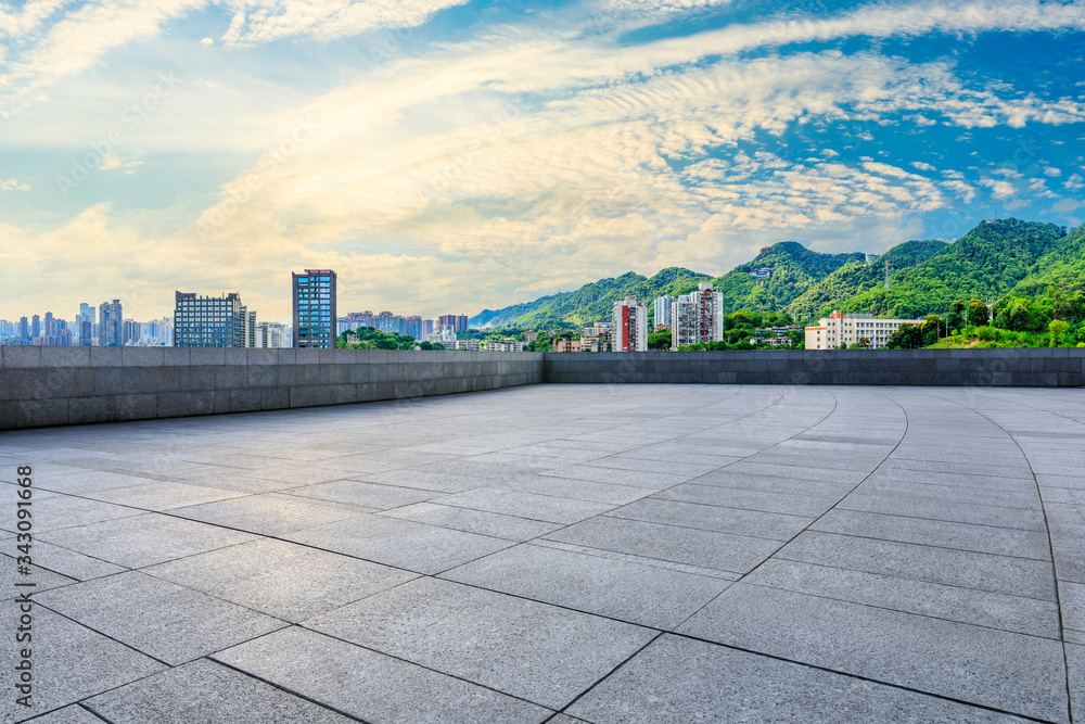 Empty square floor and chongqing city skyline at sunset,China.