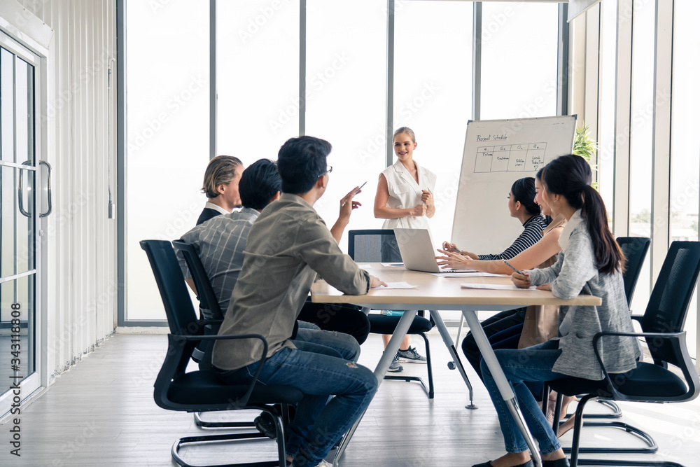 Woman leader working brainstorm to solve problem with team, presentation new idea. People discuss an