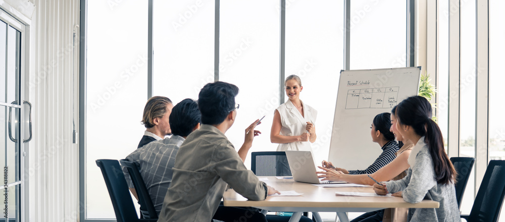 Woman leader working brainstorm to solve problem with team, presentation new idea. People discuss an