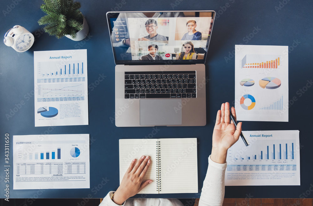 Young Asian businesswoman work at home and virtual video conference meeting with colleagues business