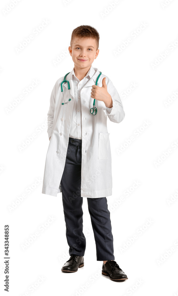 Cute little doctor showing thumb-up gesture on white background