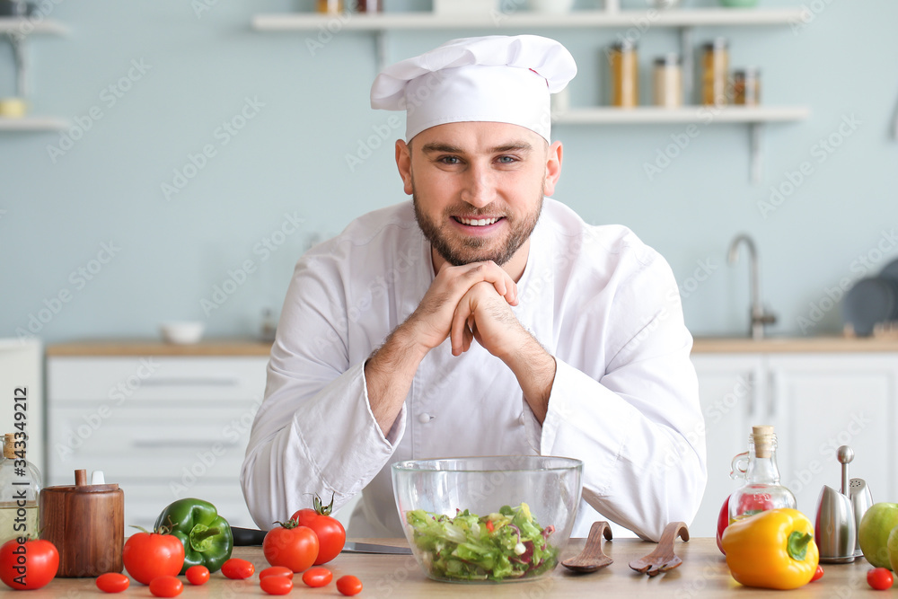 Handsome male chef in kitchen