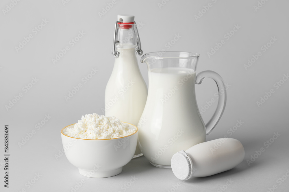 Different dairy products without lactose on grey background