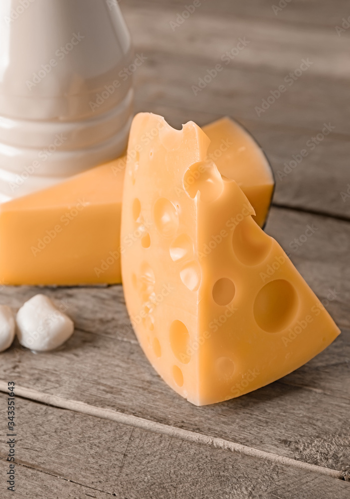 Cheese without lactose on wooden background