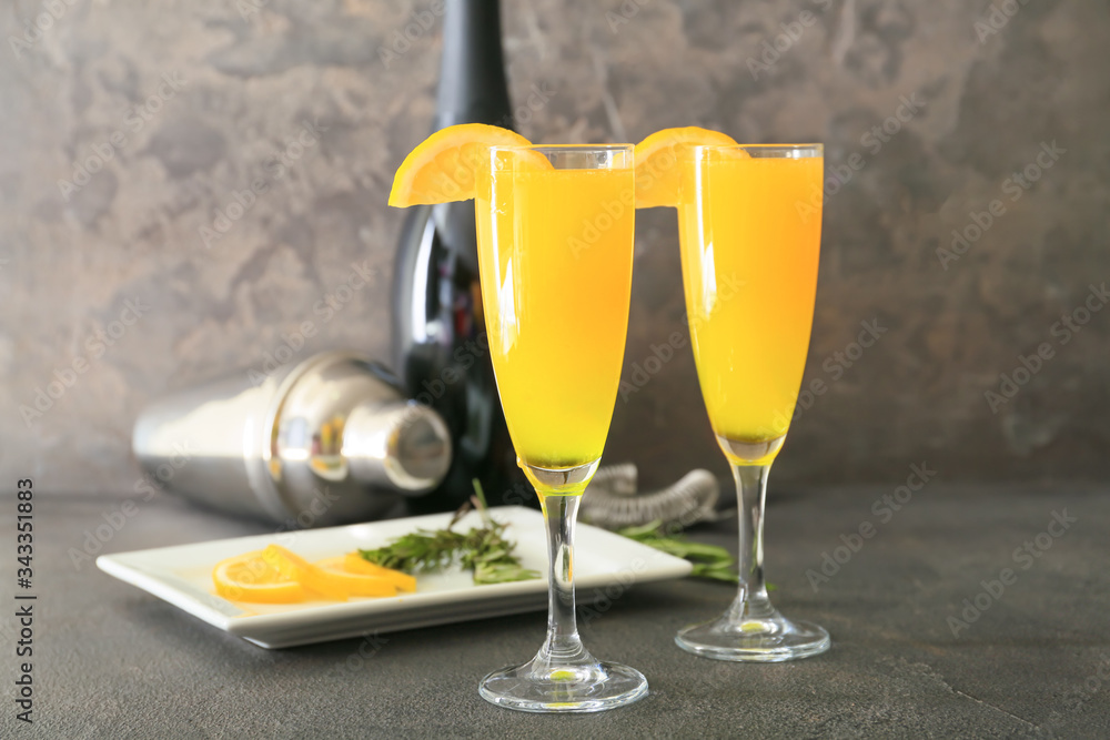 Glasses of tasty mimosa cocktails on table