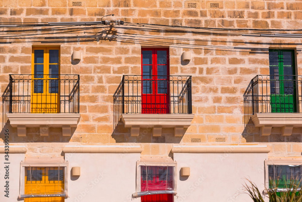 Colorful doors and windows of traditional Maltese houses