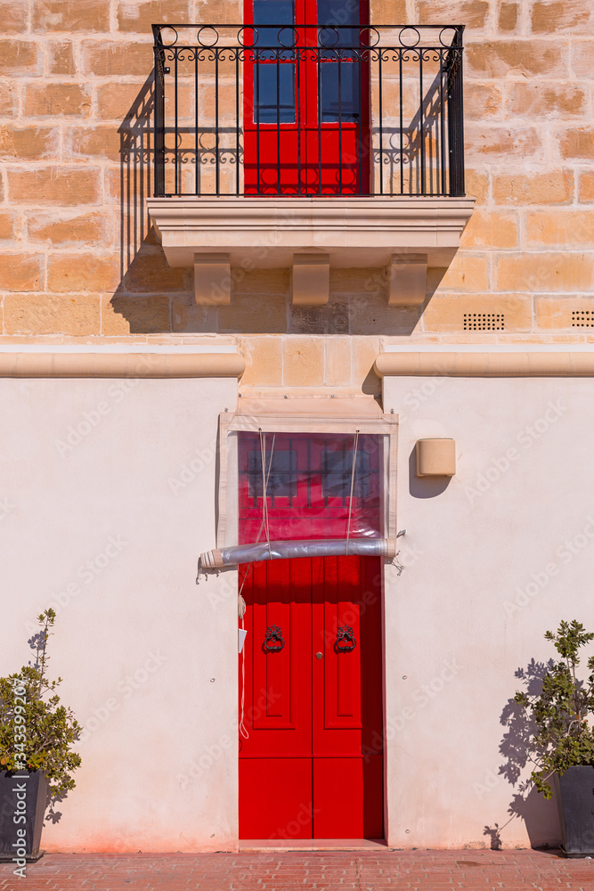 Colorful doors and windows of traditional Maltese houses