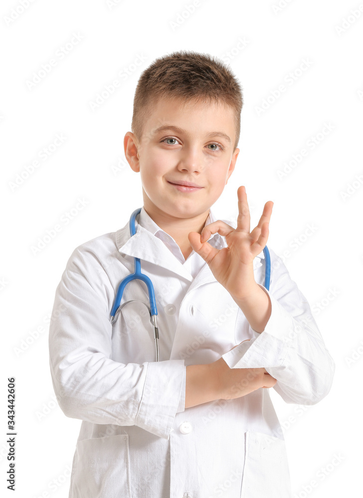 Cute little doctor showing OK gesture on white background